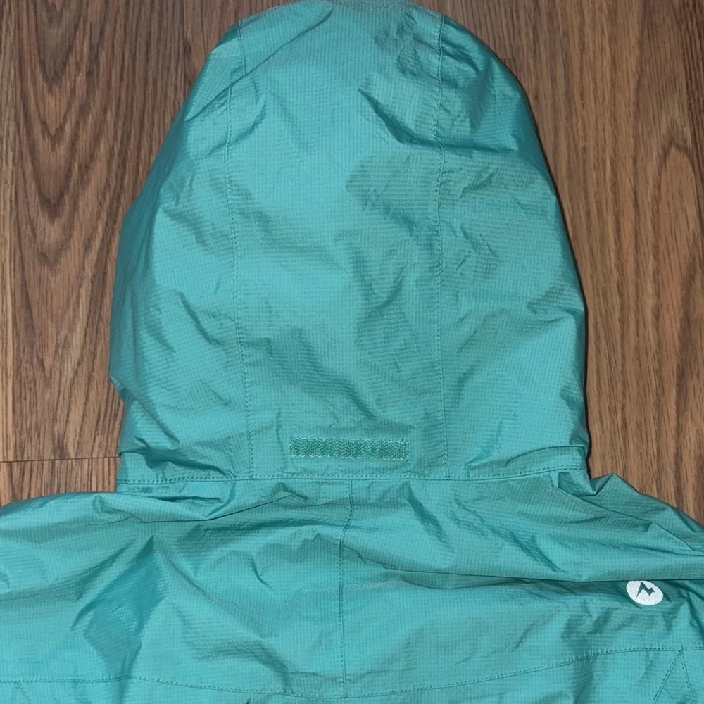 Girls waterproof jacket Marmot. Windproof. Outdoor performance wear.